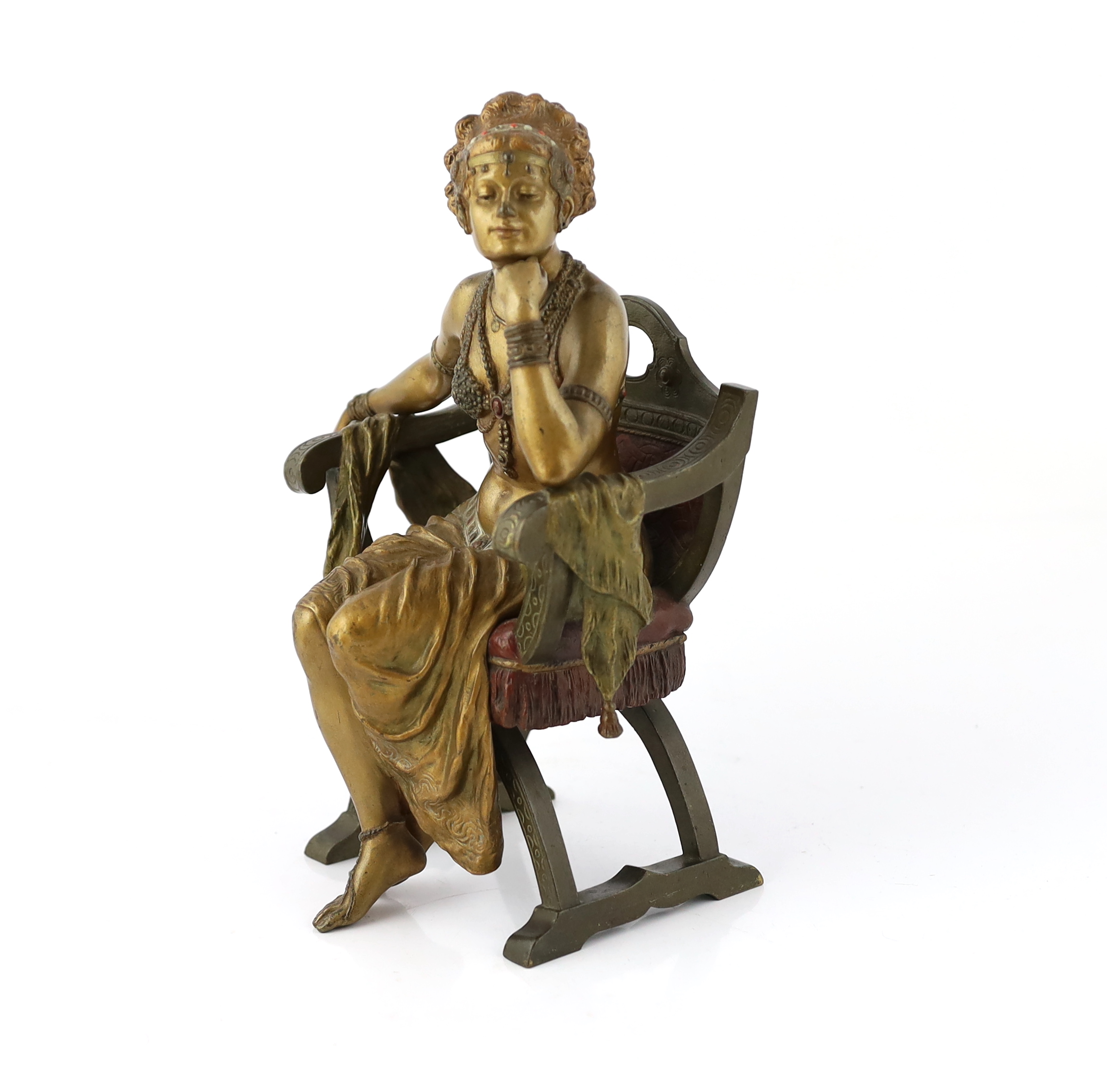 Franz Xavier Bergmann (1861-1936). An Austrian cold painted and patinated cast bronze figure of a Turkish dancing girl seated in an armchair, 20cm wide, 29cm high, Please note this lot attracts an additional import tax o